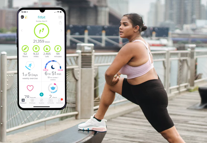 the fitbit app and a girl exercising