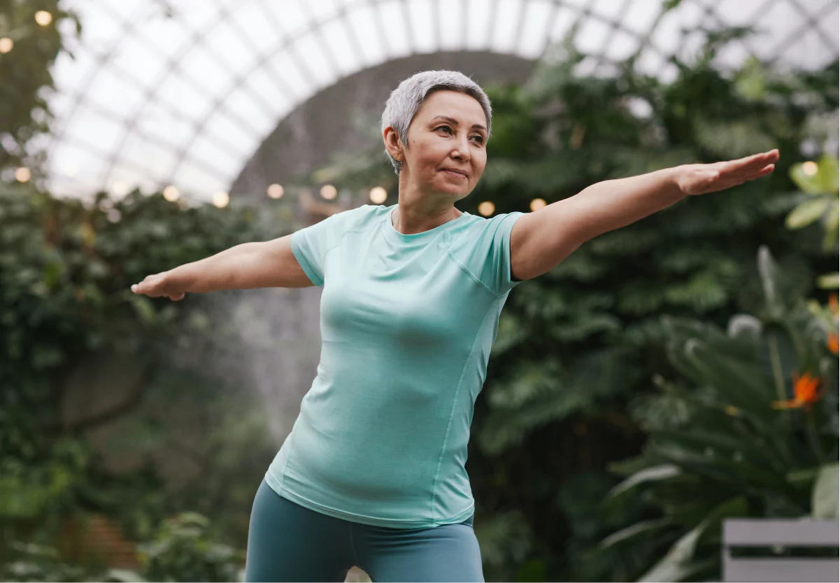 a woman doing yoga outside