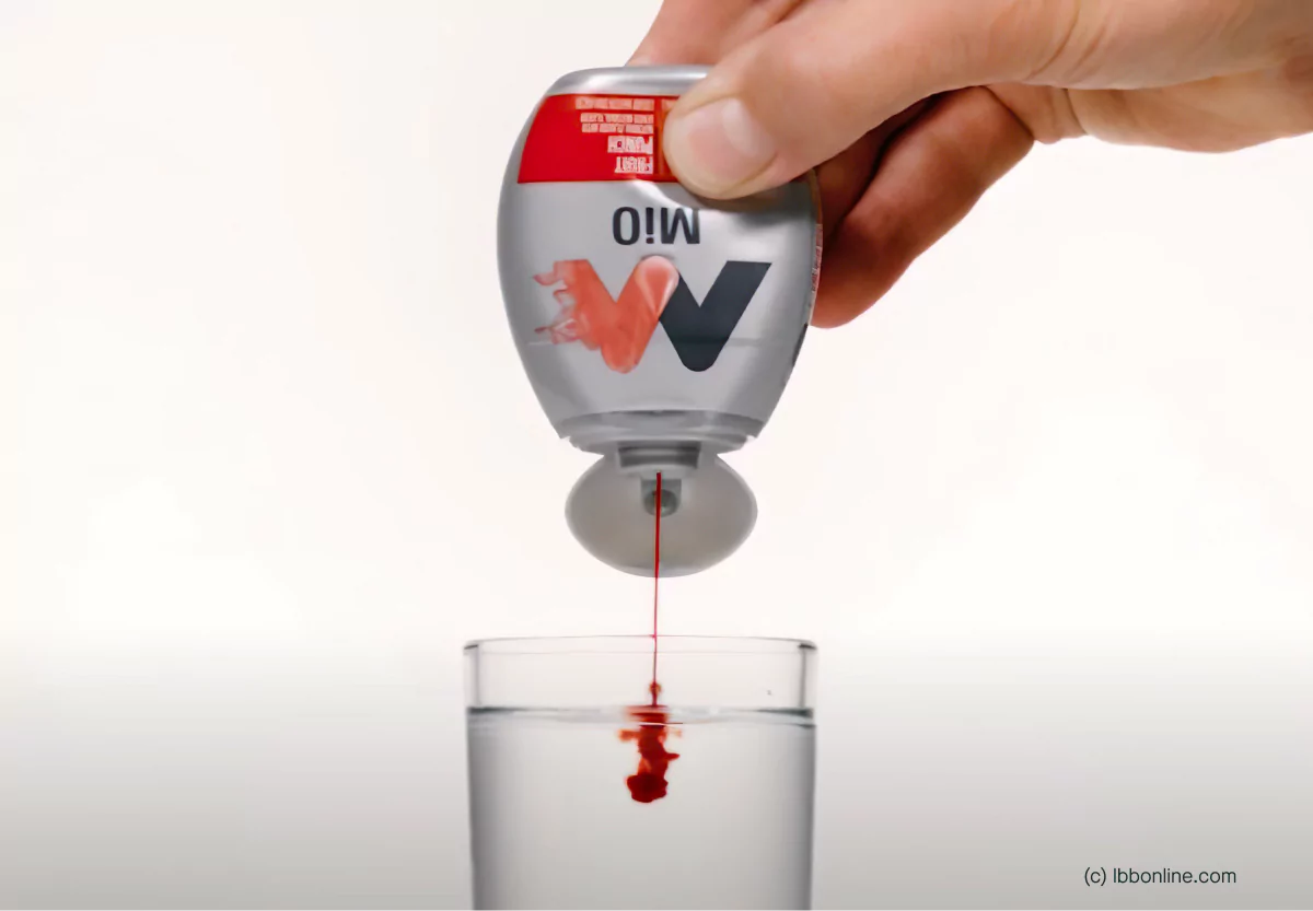 someone adding mio to water