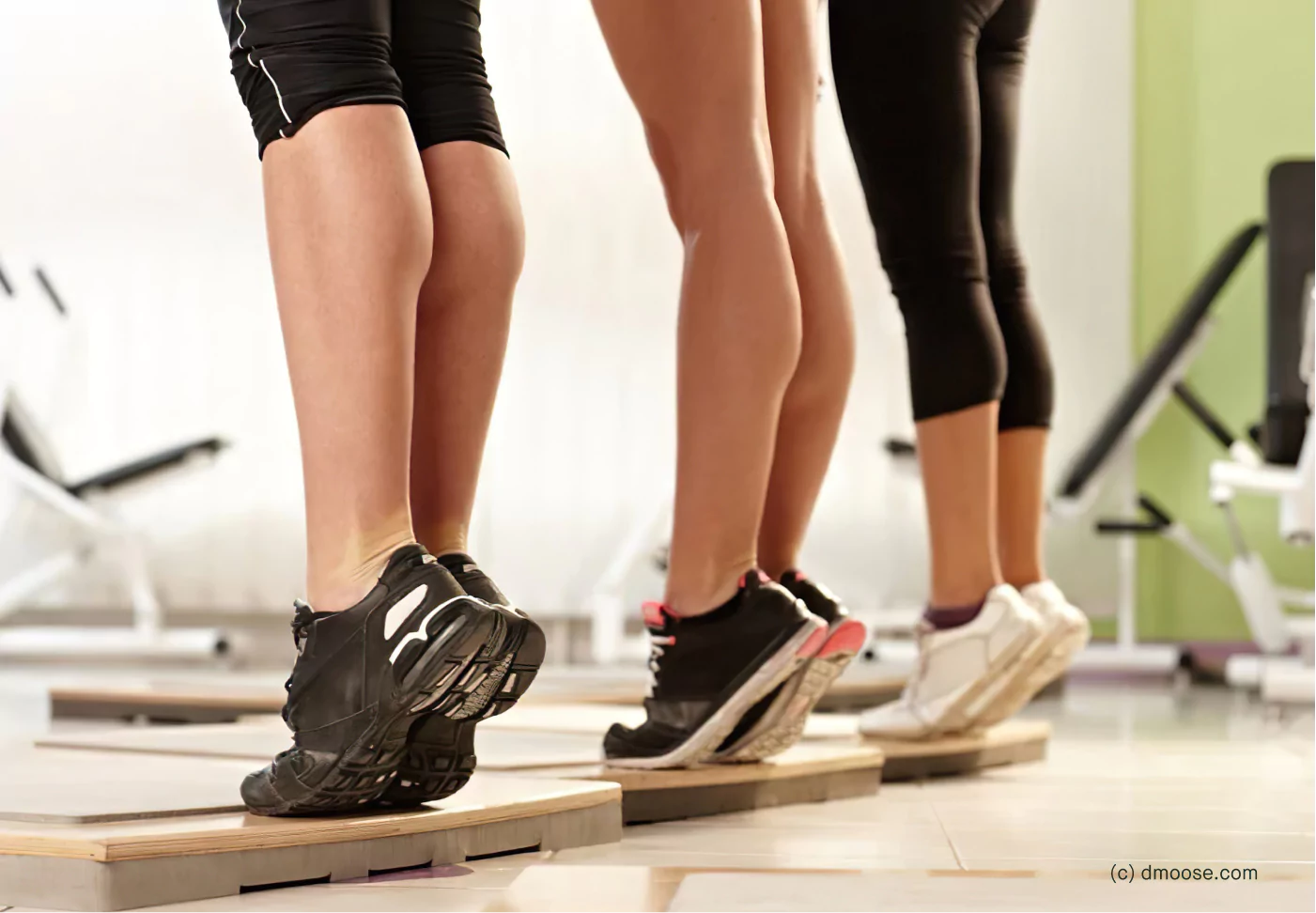 three people doing calf raises