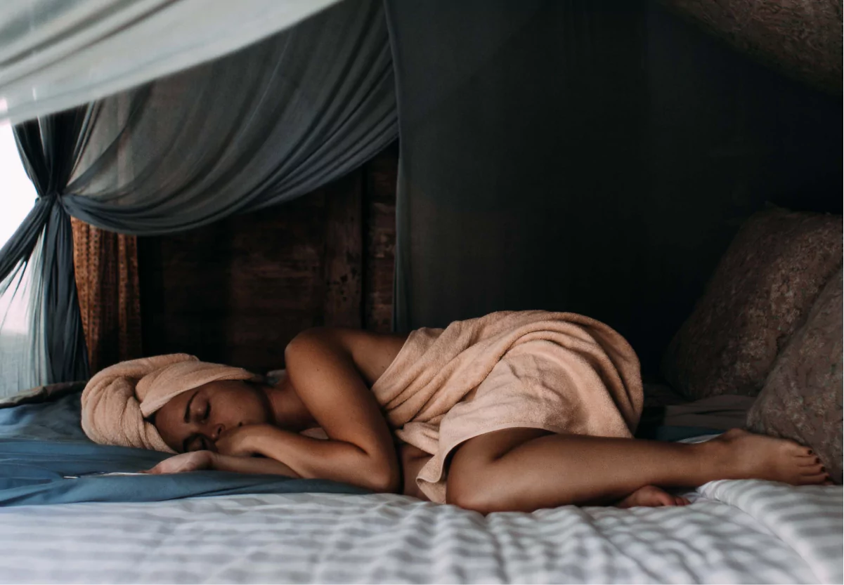 a woman sleeping in a towel