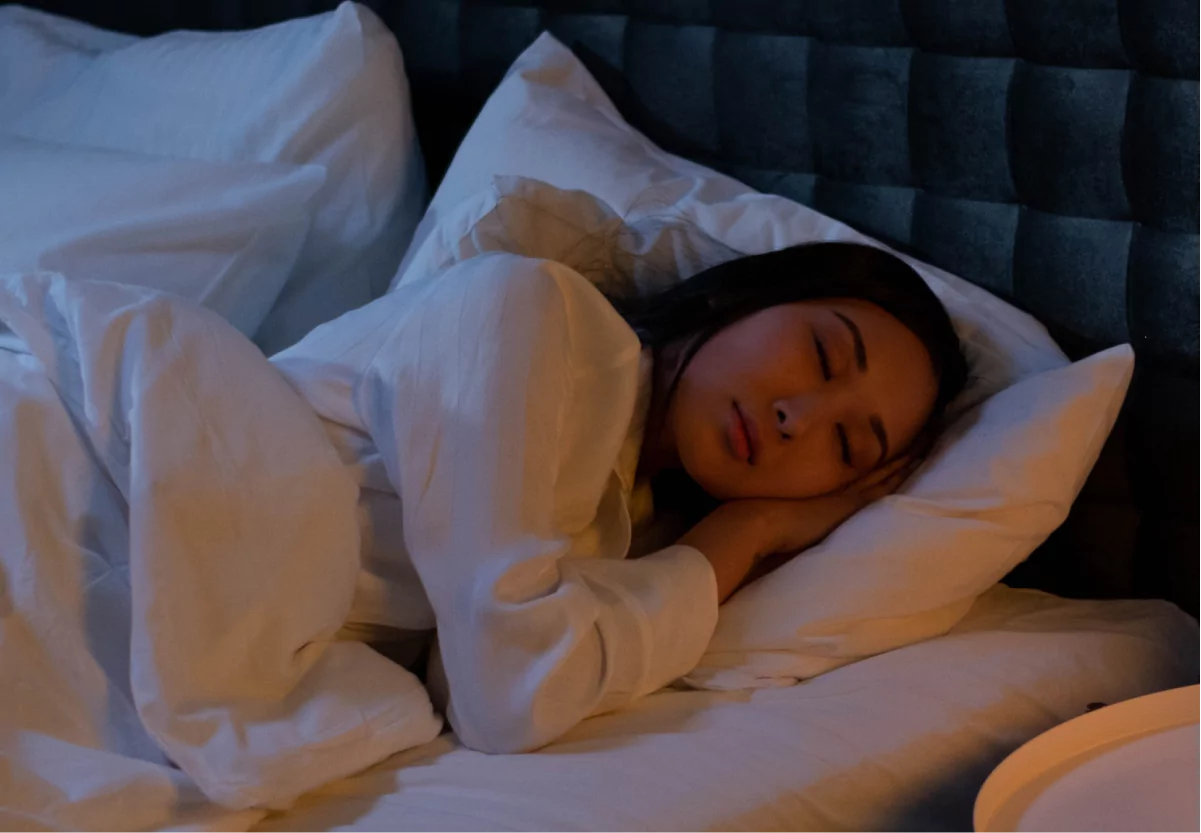 A woman with dark hair sleeping