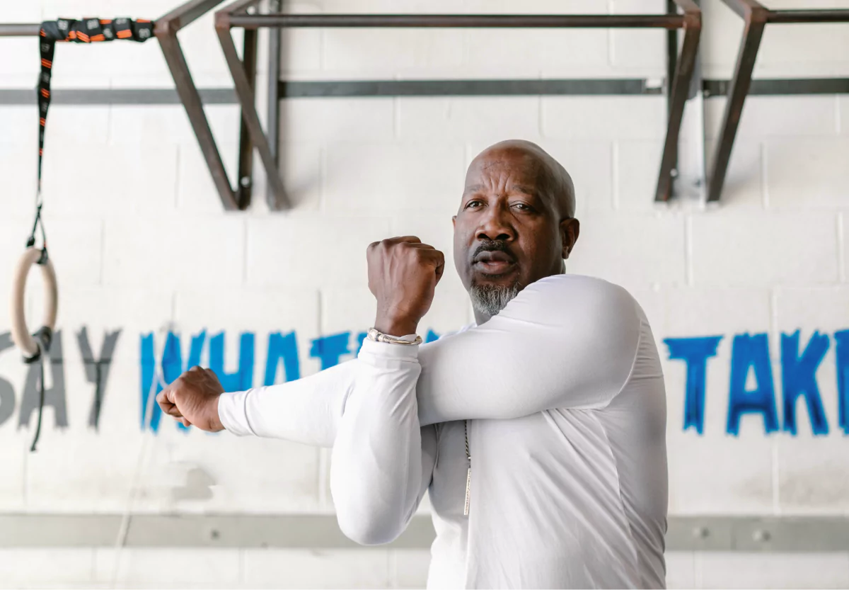 a man doing a warm up arm stretch