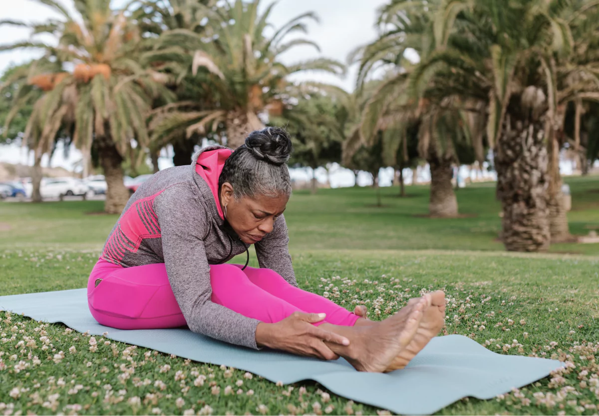 a woman stretching in the park