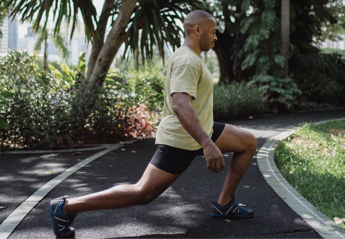 a man doing a lunge outside