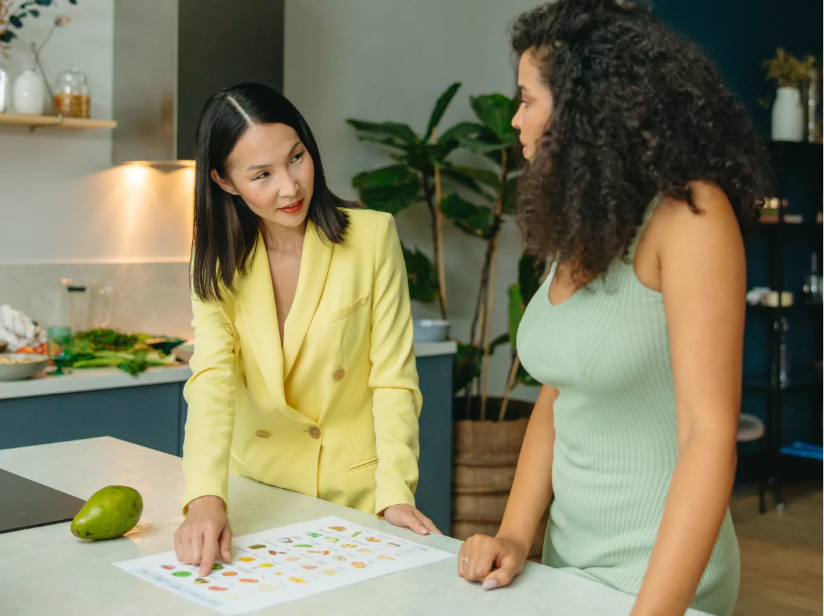 two women talking about a meal plan