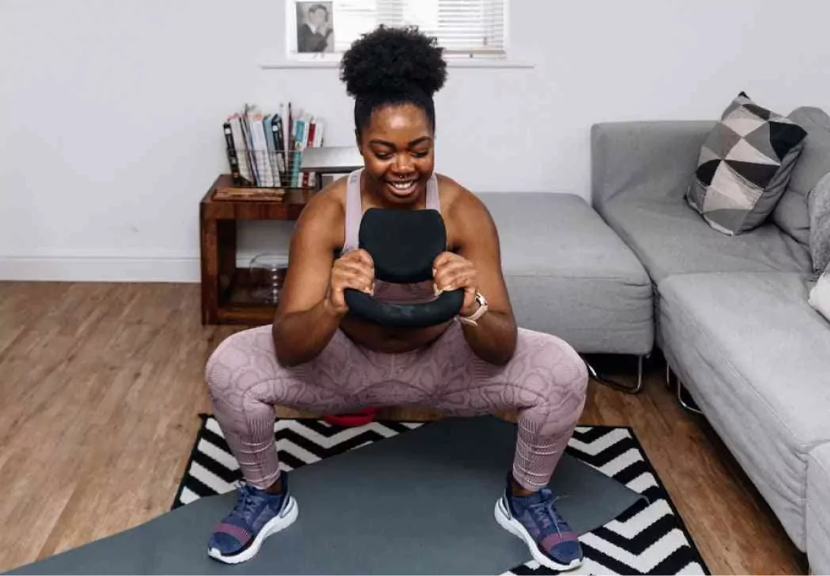 a woman doing a goblet squat