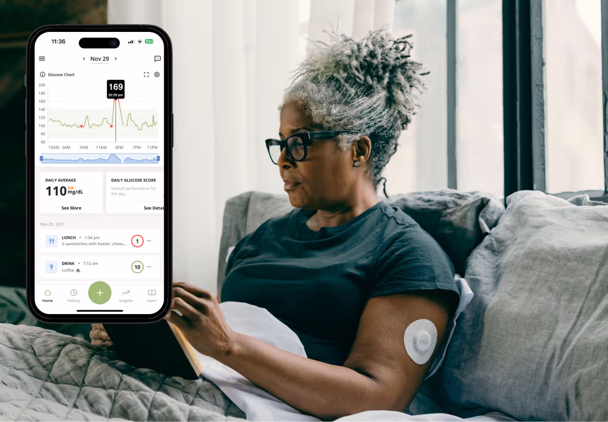 a woman using her phone and the nutrisense app