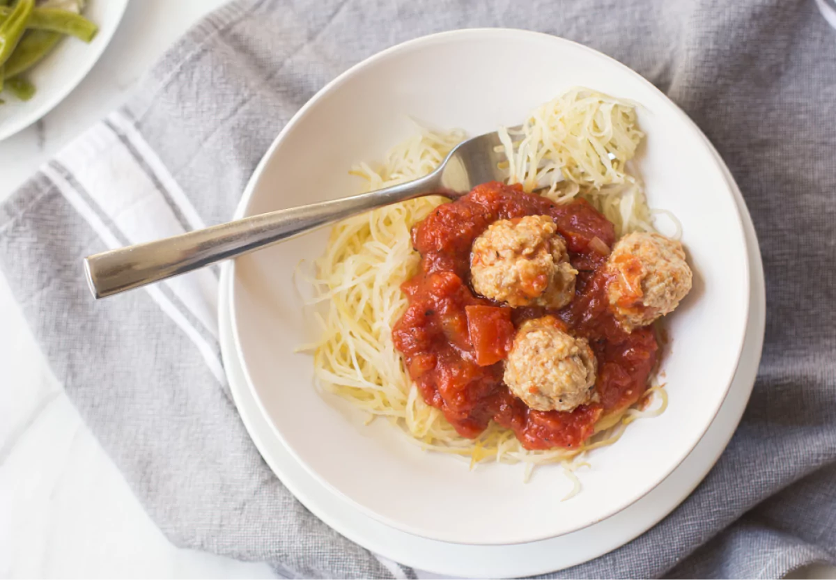 a plate of spaghetti squash and meatballs