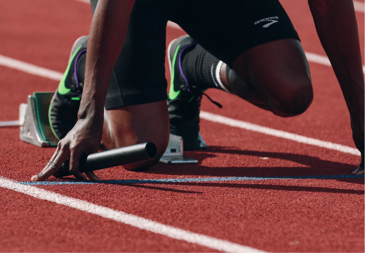 a sprinter in the blocks on a track