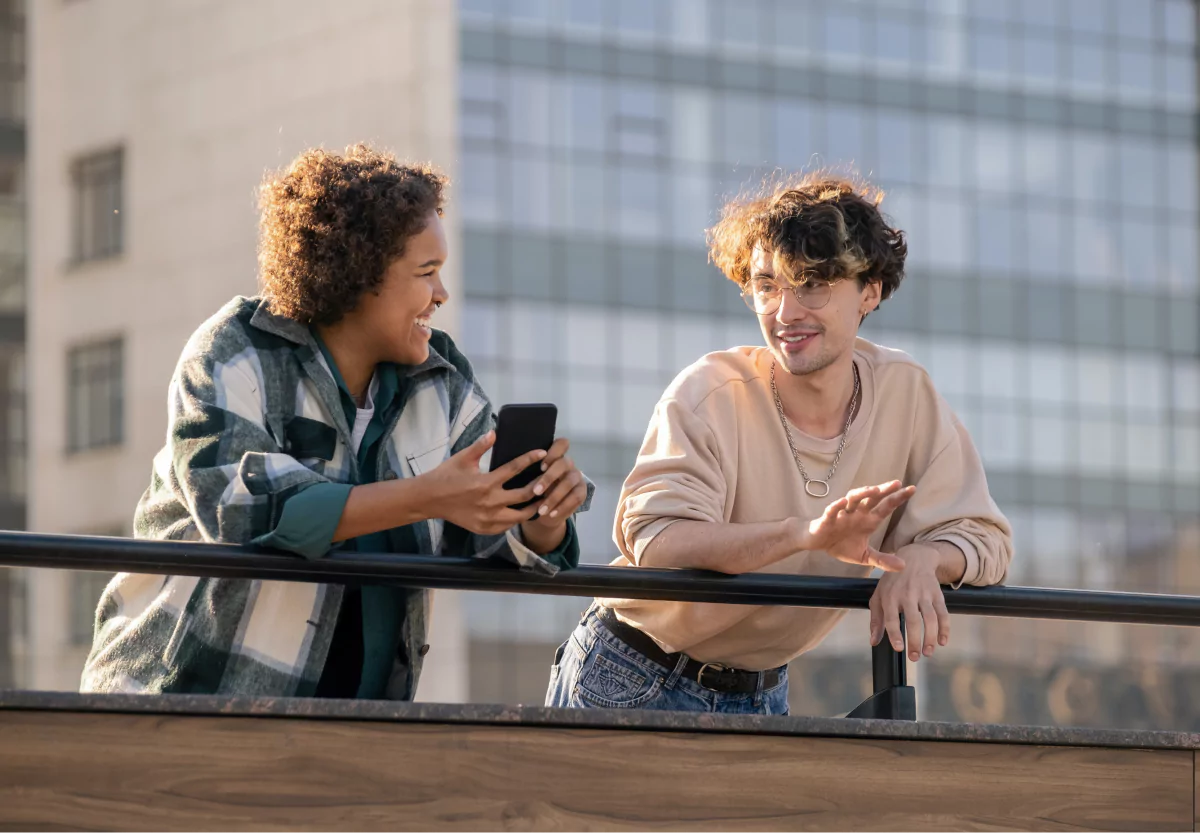 two people looking at a phone