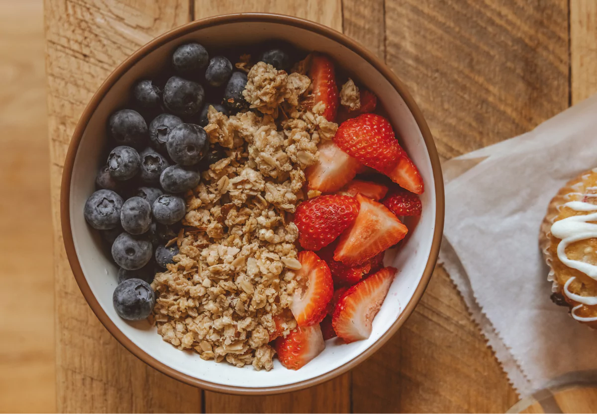 an acai bowl with granola and berries