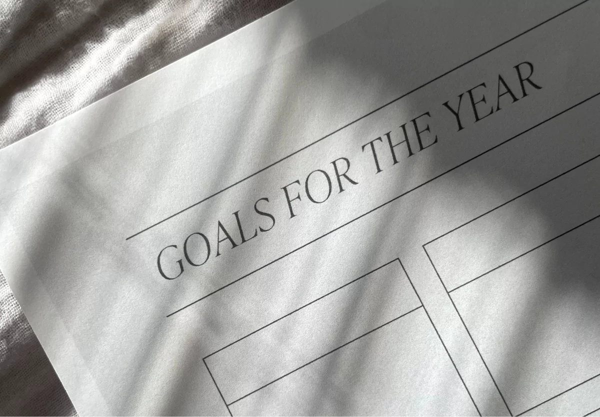 a notebook with goals for the year