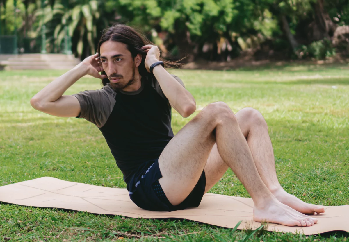 a man doing a sit up twist