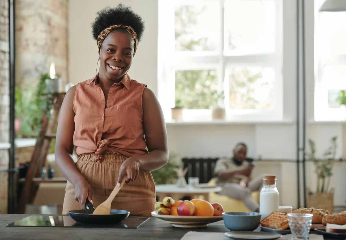 a woman smiling in her kitchen