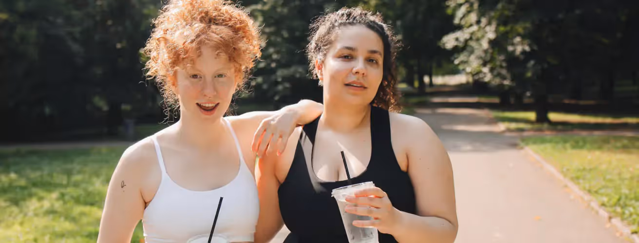 two people with lemonade in the park