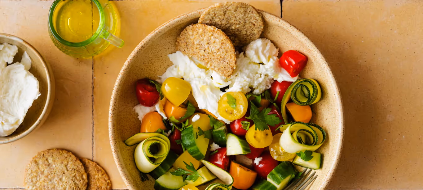 a plate of veggies, salad, and other whole foods