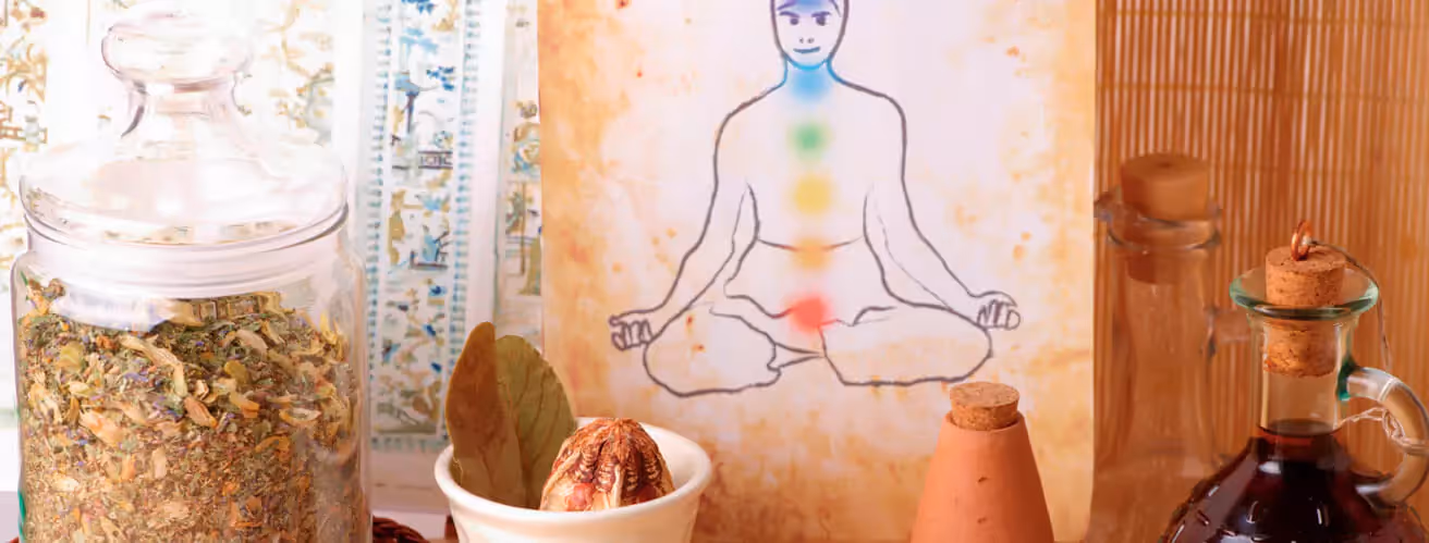 a jar of herbs, a picture of chakras
