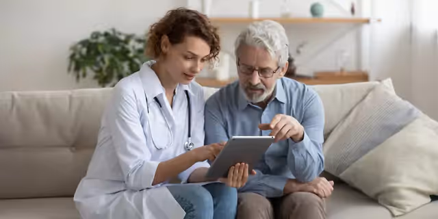 a doctor explaining a test result to an older patient