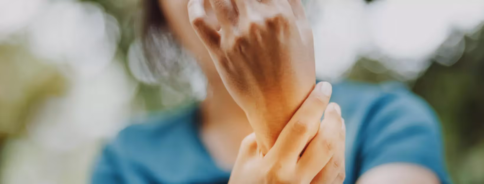 a person holding their wrist