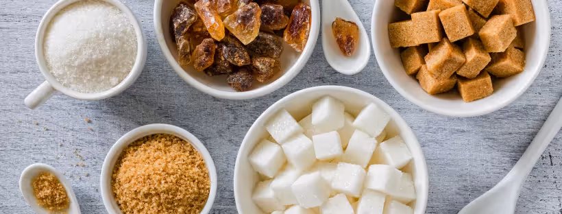 Bowls of various sizes which different types of sugar in them
