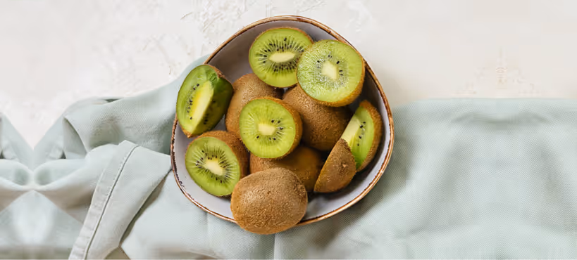 a bowl of sliced kiwi fruit