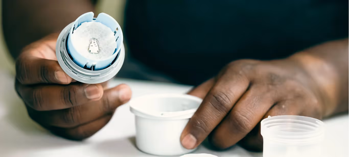 someone opening a cgm to apply it