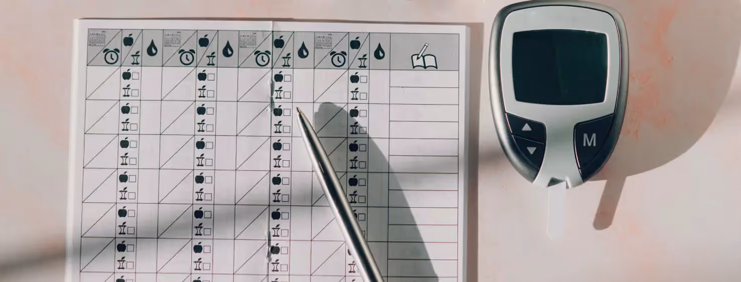 a meal notebook and a glucose monitor