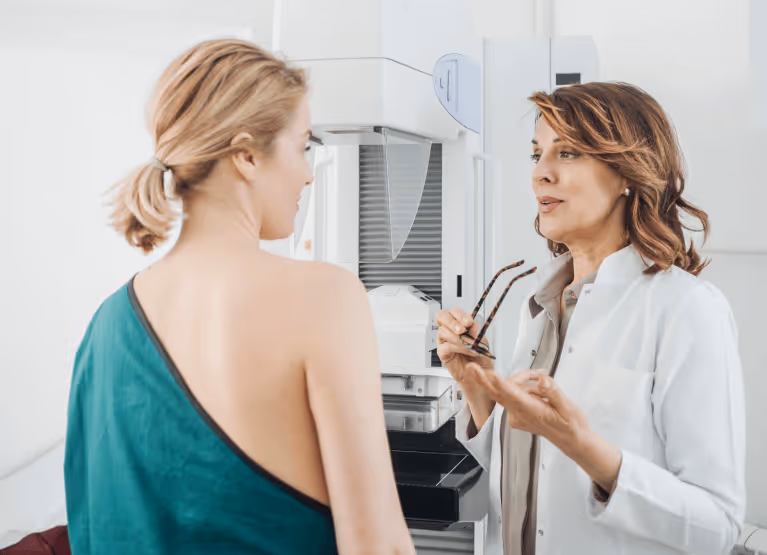 a woman speaking with her doctor