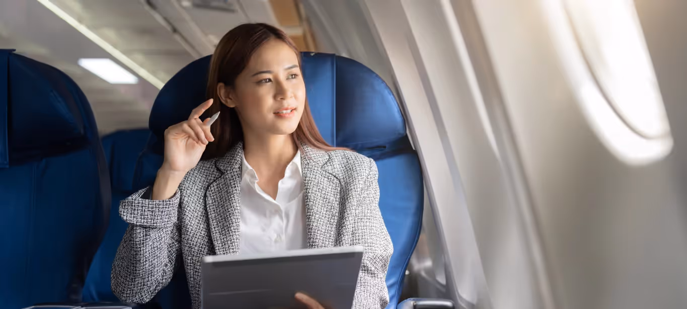 a person sitting on a plane and looking out the window