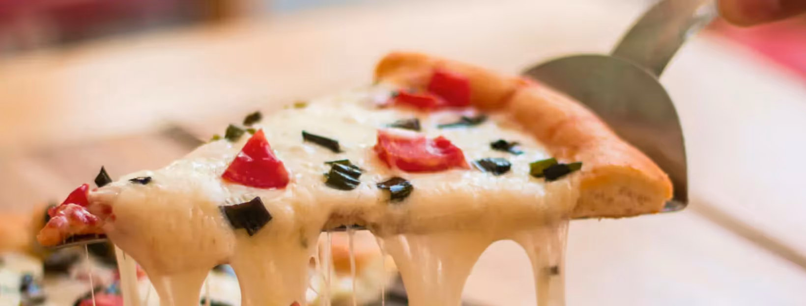 a slice of cheese and veggies pizza