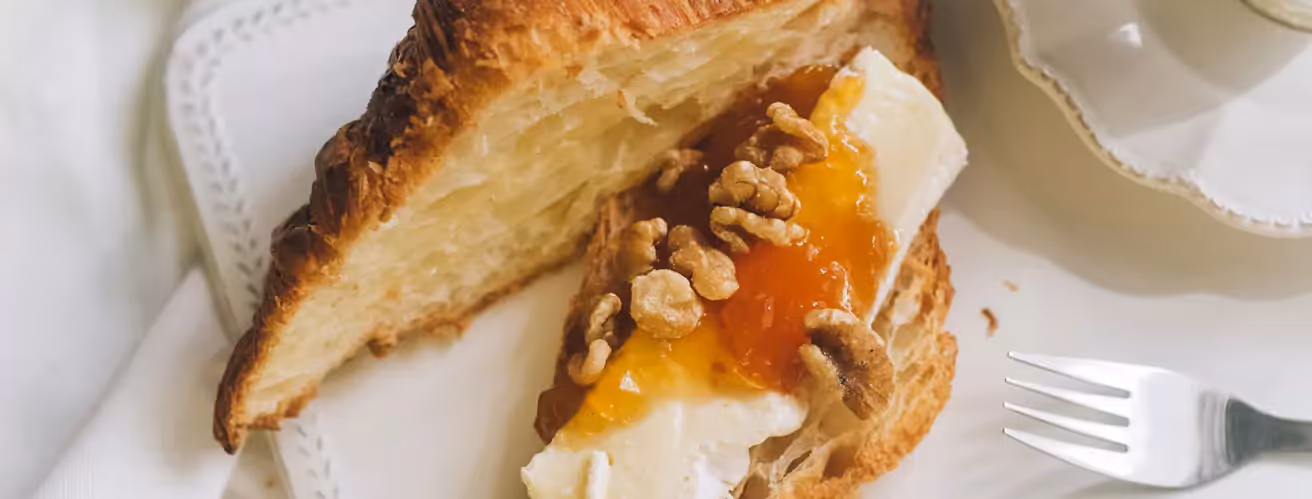 a croissant with egg and walnuts