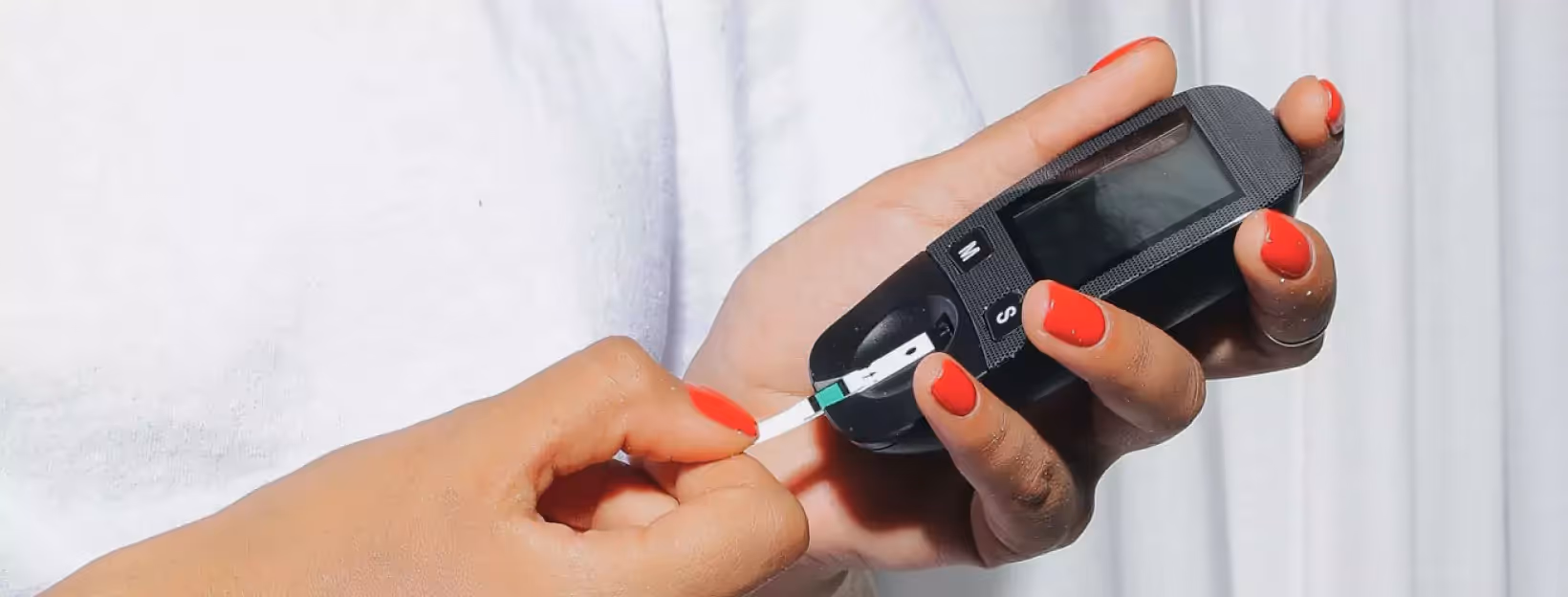 a person checking their blood sugar