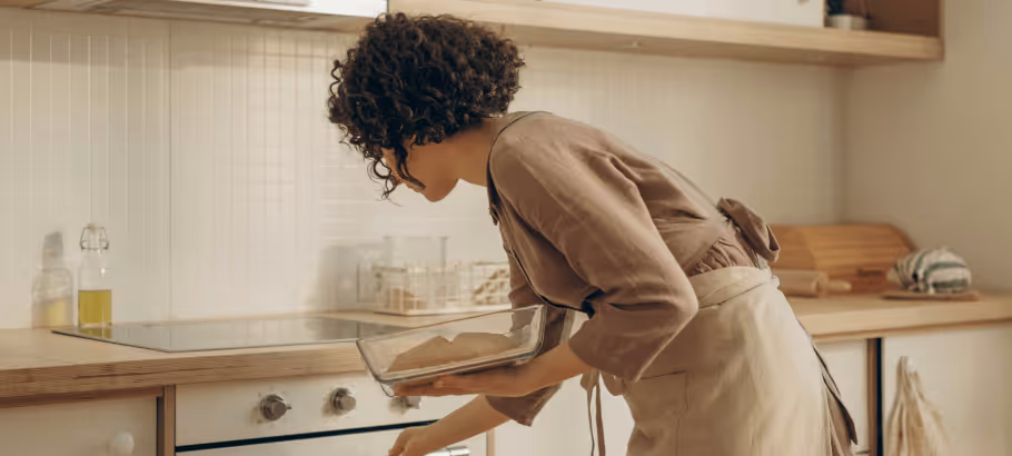 a woman cooking in the kitchen