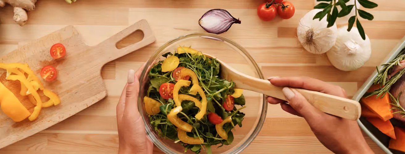 a person making a salad