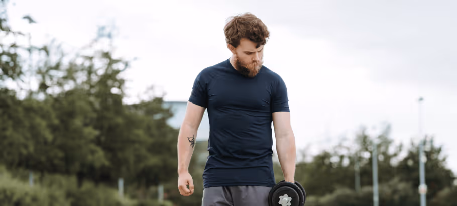 a man doing exercise in the park