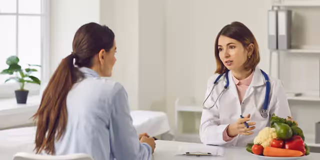 a person talking to a doctor