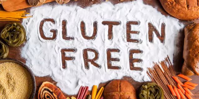 words "Gluten free" written on flour, among pasta, bread