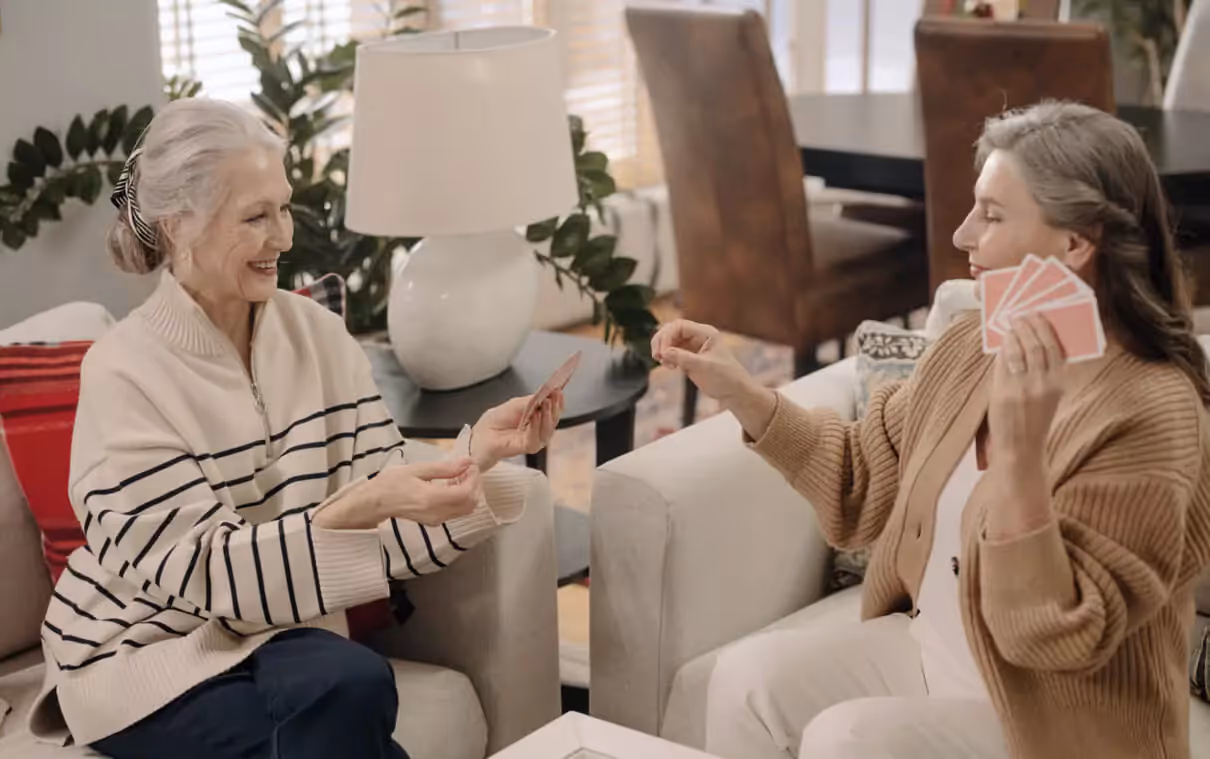 two older people playing cards
