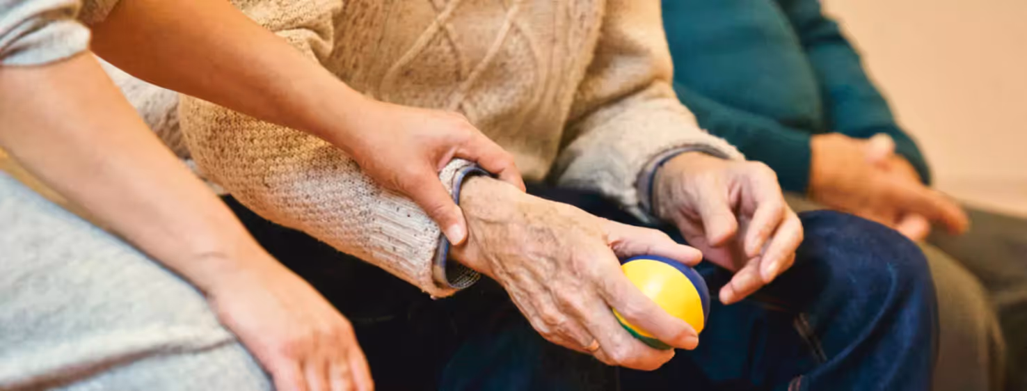 one person holding a hand of another person