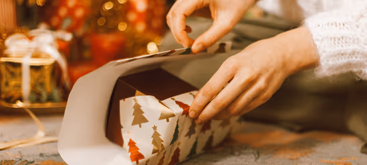 a person wrapping a present