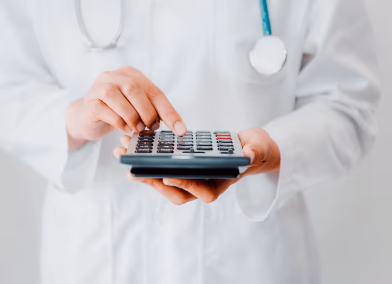 a doctor using a calculator