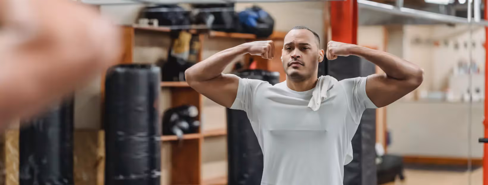 a person looking at themselves in the mirror in the gym