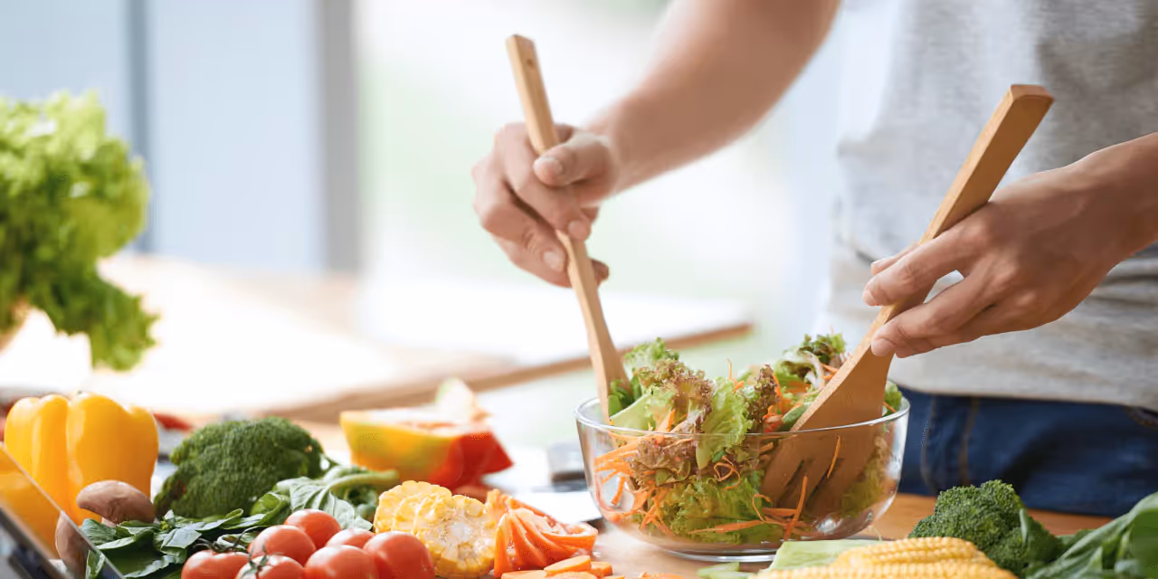 a person making a salad