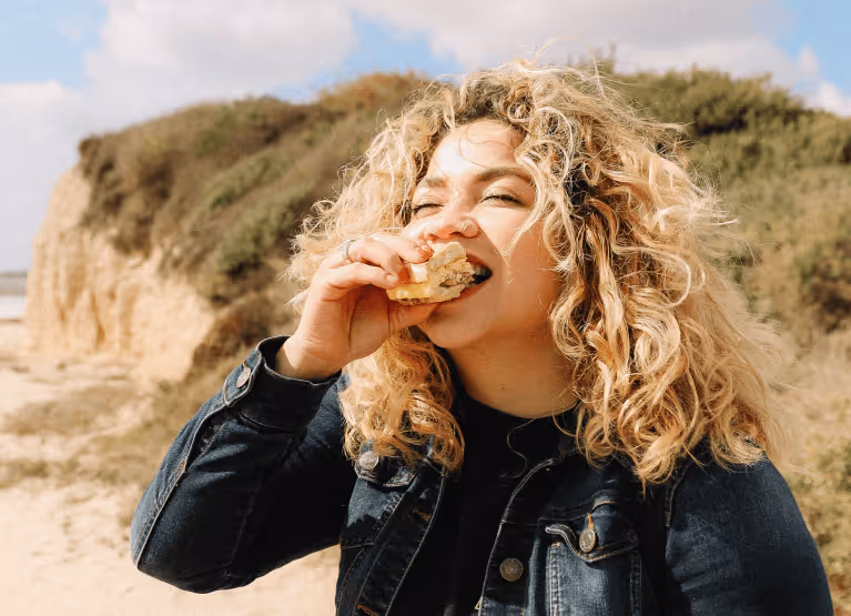 a person eating a bite of food