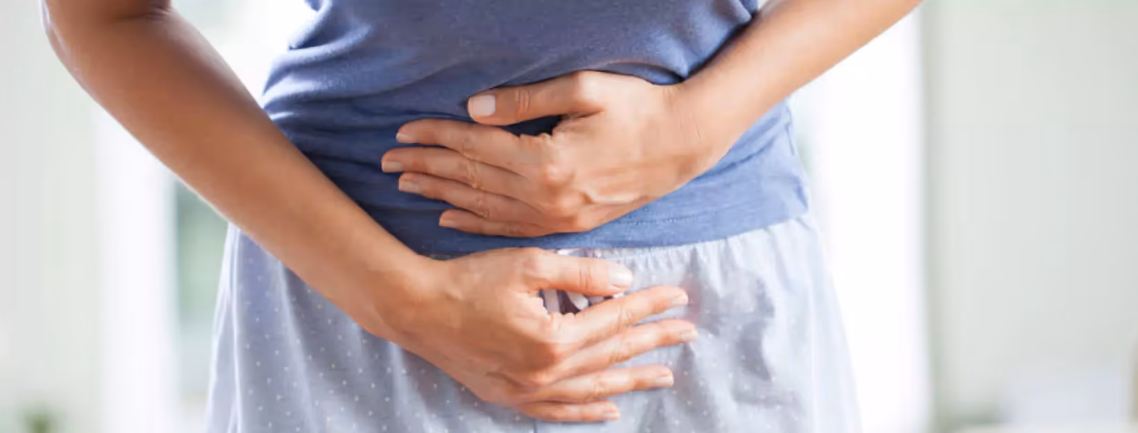 a person holding their stomach