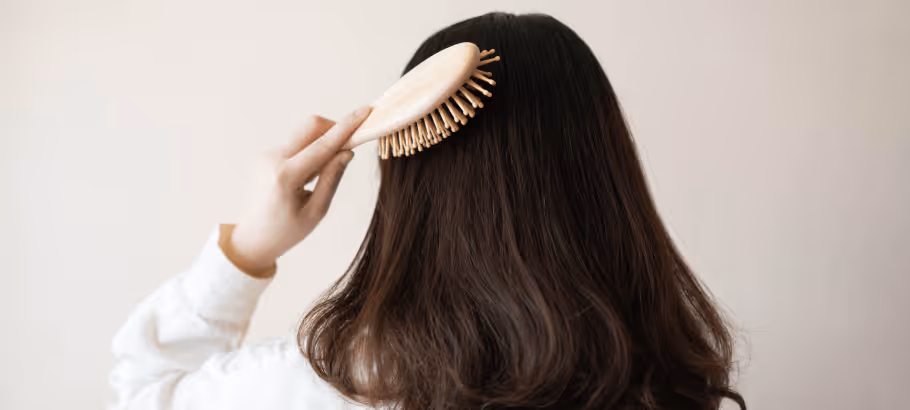 a girl brushing her hair