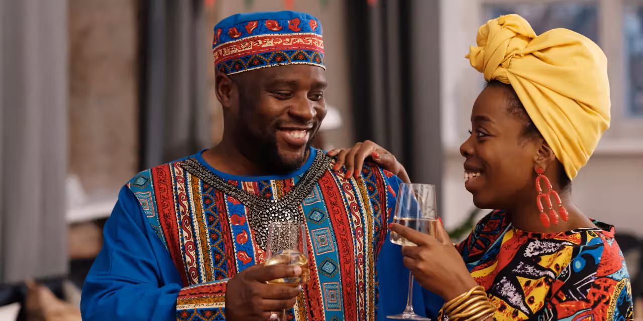 two people drinking wine