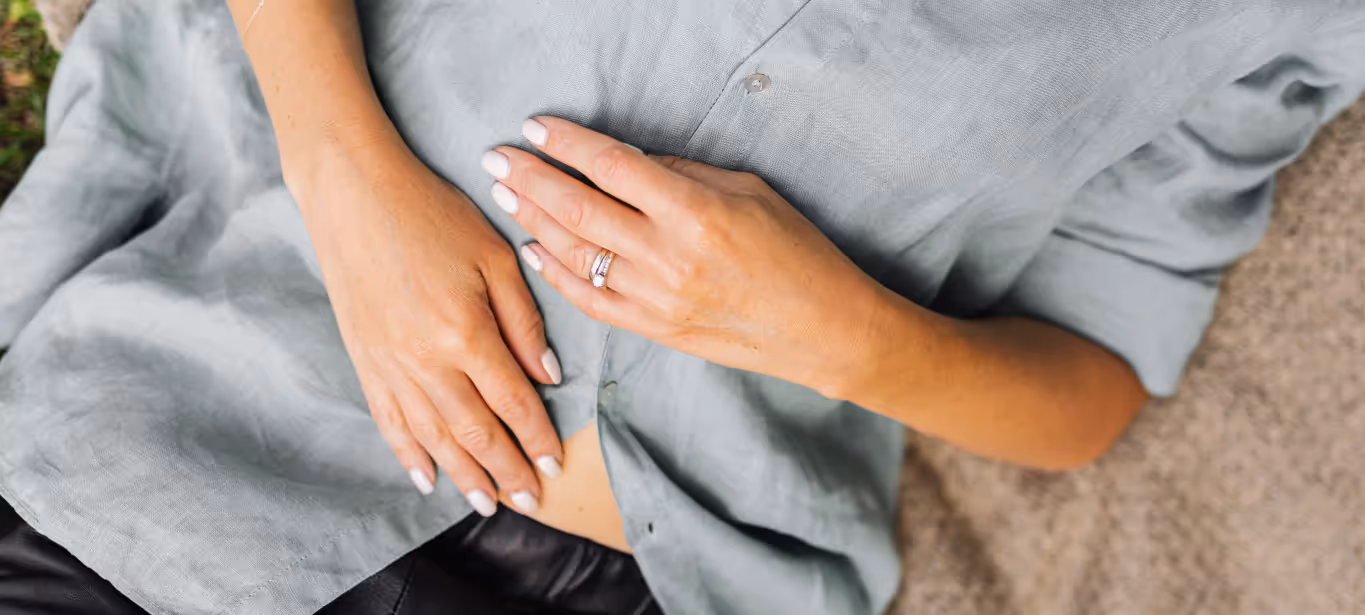 a woman holding her stomach