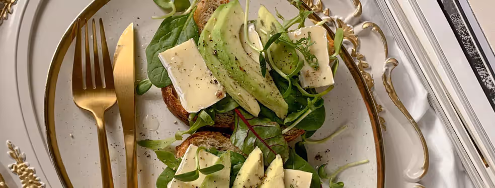 two avocado toasts on a plate